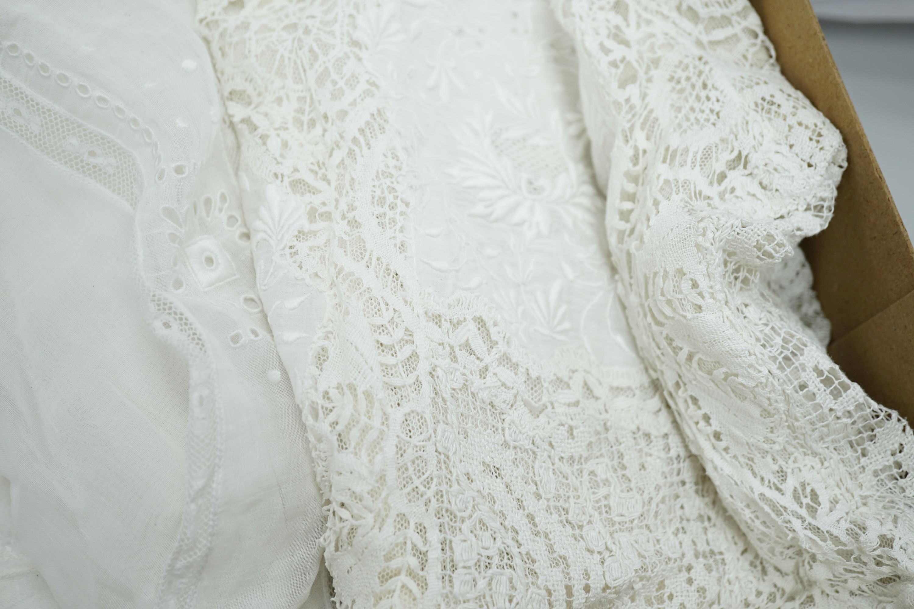 A 19th century hand made Irish crochet jacket, with long sleeves and high collar, a bobbin lace and white worked patch worked blouse, a fine lawn and anglaise worked blouse and a fine bobbin lace trimmed and white worked